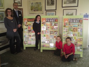 General Manager Terry Crawford welcomes the Versatile Project to its new home at the Art Cafe at the Pavilion  Gardens. Caroline Chouler-Tissier - Project co-ordinator and ceramic artist was delighted to hand over the artwork to the Gardens new caf�. With them are students from two of the participating schools represent the 150 adults and children's groups that made the work to celebrate 30 years of The Buxton Festival Fringe.